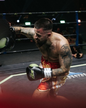 Daniel fighting in a boxing ring
