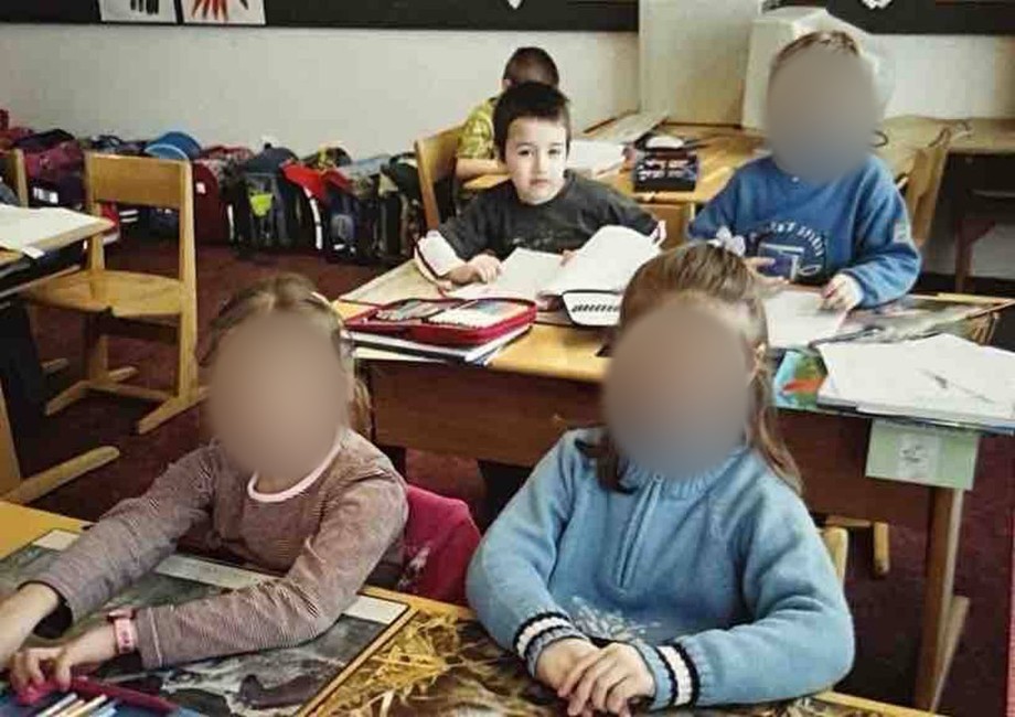 Daniel as a child in a classroom