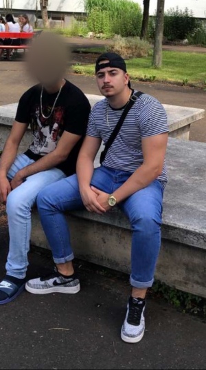 Daniel with a friend on a bench