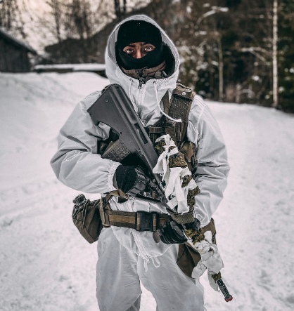 Daniel in military winter gear in the snow